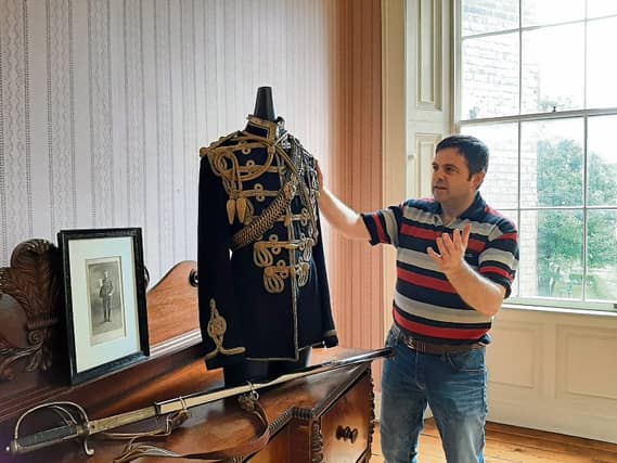John Power examining one of the exhibits commemorating lost Irish soldiers in the First World War