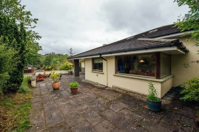 Outside the property is situated on a spacious corner site with ample parking for several cars and a tarmacadam driveway, with the front and back gardens in lawn and well-maintained with flower beds and a patio area to the side of the house.