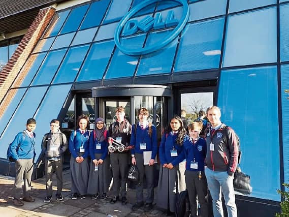Members of the school's robotics club on their visit to Dell