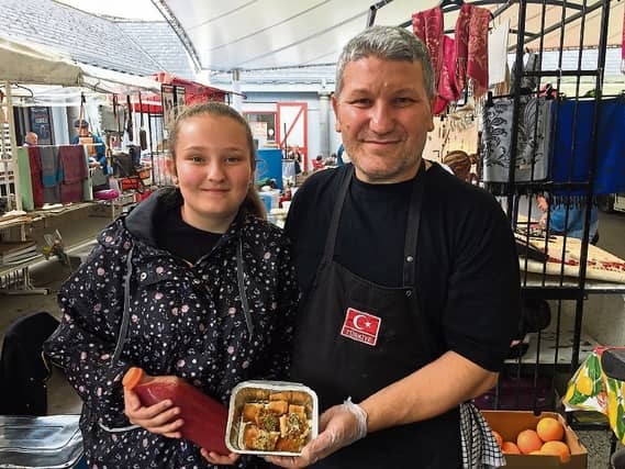 Fenerbahce fans: Sefik Dikyar with his daughter, Leyla, at their busy Milk Market stall