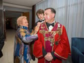 Cllr James Collins receiving help with his chains from his Aunty Hilary Collins and son Eoghan Collins | Picture: Alan Place