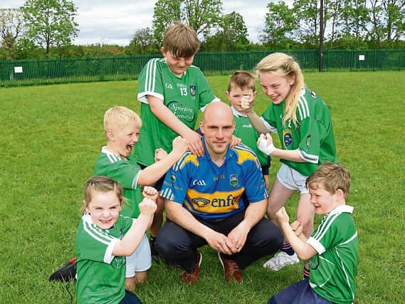 Pupils show their support for Limerick Hurlers: Lila O' Sullivan, Sam Hogan, Cormac Ryan Rian Hurley, Tara Madigan, and Gearoid O'Callaghan with principal Richie Ryan | Picture: Michael Cowhey