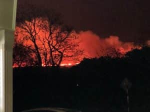 Raging blazes on the surrounding hills can be seen from Daly's Emo filling station on the N81 at Hollywood.
