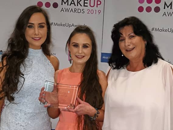 A delighted Andrea with her sister Abigail and mother Eileen
