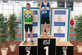 North Leitrim AC's Aaron Bradshaw receives his silver medal after the Athletics Ireland U19 Indoor Triple Jump