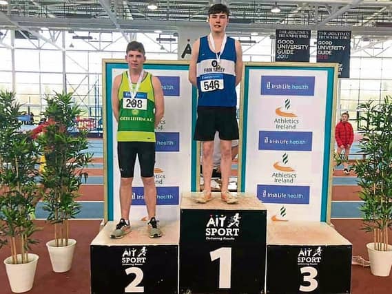 North Leitrim AC's Aaron Bradshaw receives his silver medal after the Athletics Ireland U19 Indoor Triple Jump