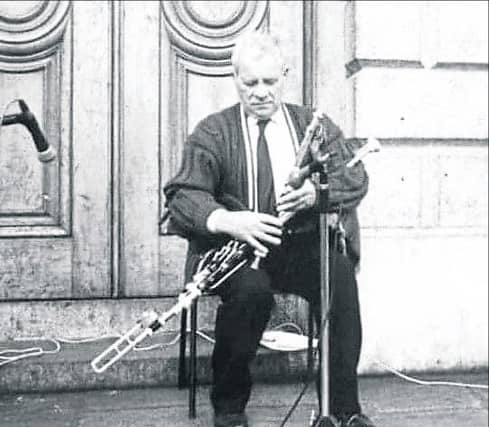 Famed Longford piper, the late Peter Carberry, pictured performing at College Green, Dublin in 1988