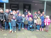 Virginia O'Dowd, kneeling, with some of those who took part in last year's community rail trip to Limerick on Ice