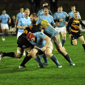 Alan Kennedy, Young Munster captain, in action against Garryowen's Niall Horan and Andrew Keating