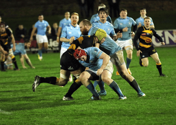 Alan Kennedy, Young Munster captain, in action against Garryowen's Niall Horan and Andrew Keating