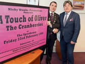 Nicky Woulfe presents Mayor James Collins with a poster to mark Dolores O'Riordan's anniversary Picture: Brendan Gleeson
