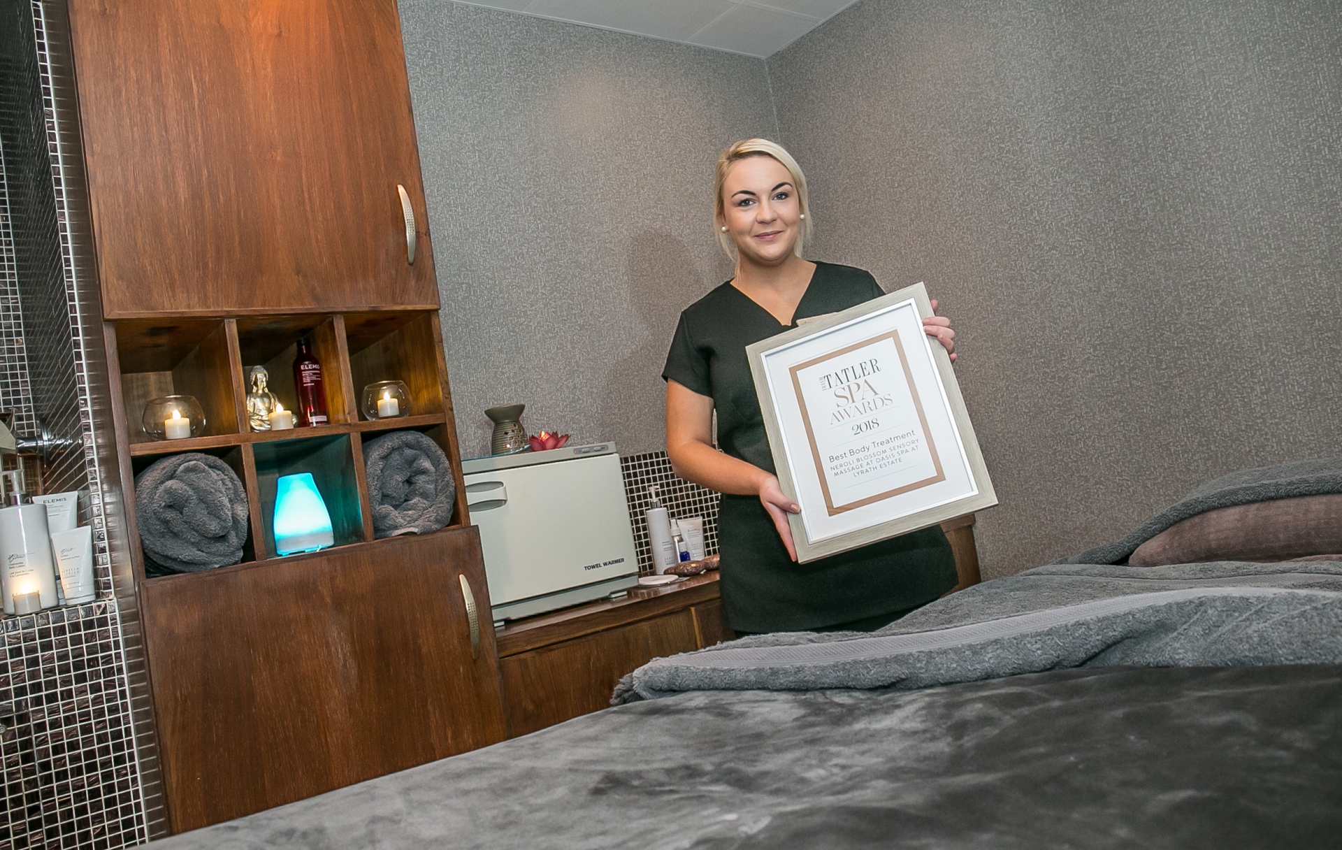 Therapist Jessica Maguire with the award at the Oasis Spa