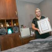 Therapist Jessica Maguire with the award at the Oasis Spa