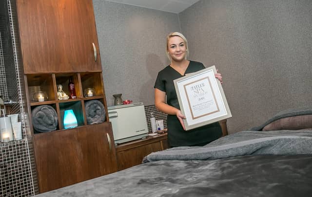 Therapist Jessica Maguire with the award at the Oasis Spa