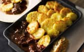 Beef casserole with sliced potato topping