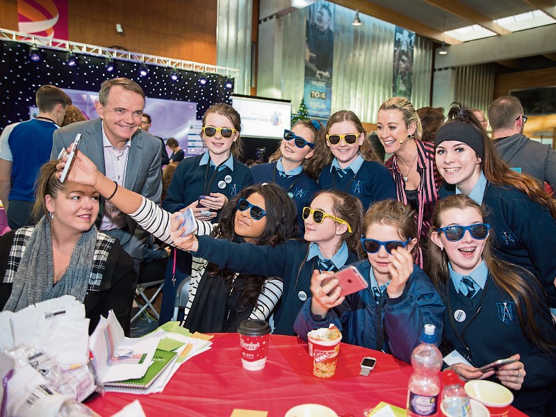 A happy group from Ard Scoil Mhuire, at the Irish Technology Leadership Group’s young innovators in Shannon Airport with Dragons Chanelle McCoy and Barry O’Sullivan
