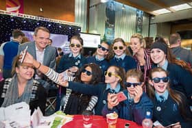 A happy group from Ard Scoil Mhuire, at the Irish Technology Leadership Group’s young innovators in Shannon Airport with Dragons Chanelle McCoy and Barry O’Sullivan