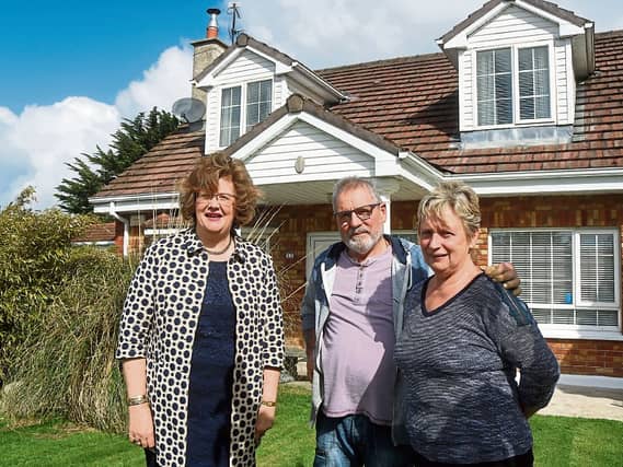 Senator Maria Byrne, with Leonard and Majella Croxton, whose home has been affected by pyrite, below