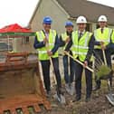 Minister of State Alan Dillon turning the sod on the housing project in Achill in August 2024
