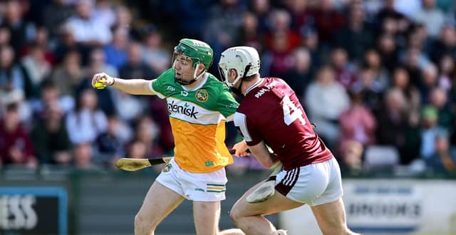 Adam Screeney tries to get away from Darren Morrissey.