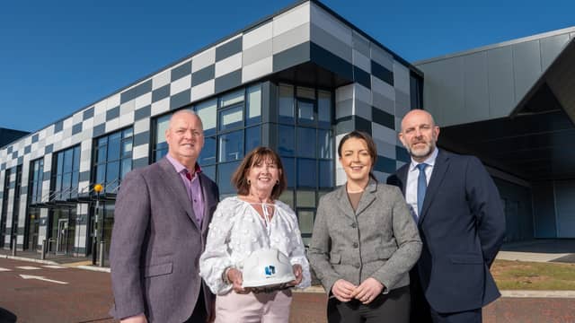 Paul McLean, Contracts Director, Henry Brothers; Julie McKeown, Director, Henry Brothers; Liz Kimmins, Minister for Infrastructure; and Jeremy Logan, Chief Executive, Driver and Vehicle Agency.