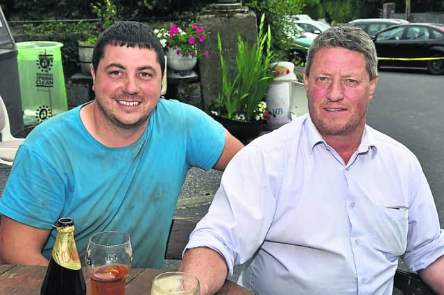 Tom Nolan and Keith Hatton enjoy a pint in Johnswell while watching the Road Hurling PICTURE: HARRY REID