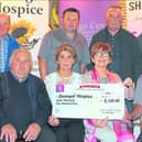 South Donegal Vintage and Heritage  club  members  present cheque to Annette Cunningham , Donegal Hospice PRO.