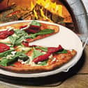 Serious about pizza? Why not invest in a pizza stone (basically a slab of granite)?