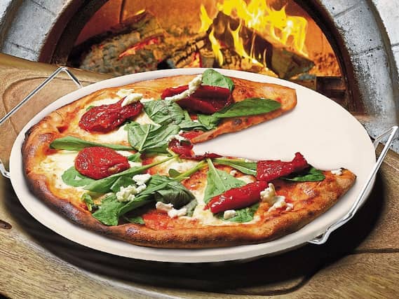 Serious about pizza? Why not invest in a pizza stone (basically a slab of granite)?
