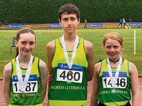 North Leitrim AC's walking medalists Niamh Carolan (U15 gold), Darragh Mitchell (U16 bronze) and Sara O'Beirne (U14 silver) pictured with their medals