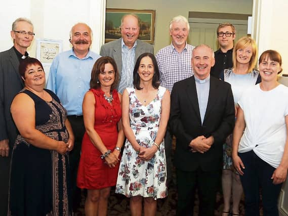 Gone but not forgotten: Organisers wish Fr Brendan Kyne, front, the very best in the future after his farewell Mass Picture: Brendan Gleeson