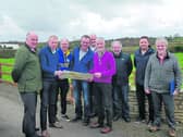 Cllr Joe Flaherty, Deputy Timmy Dooley, Wesley Jordan, Dominic McGrath, Jim McCausland, Willie Dennigan, Declan Shanley, Niall Dennigan and Michael Keating looking at the  plans for the proposed Derry