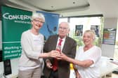 Ita Ward (left) and Ann Glancy (right) from  Twin Towns Group  as they accepted an Outstanding Commitment Award from Concern co-founder John O’Loughlin Kennedy. Picture Jason Clarke Photography.
