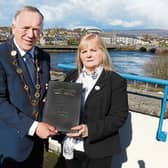 One of the sombre occasions of Mayor Keary’s office took place in March, when he handed over a packed book of condolences to Eileen, the mother of the late Dolores O’Riordan Picture: Adrian Butler