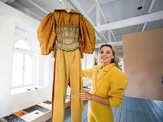 Mungret woman Aoife McNamara with a piece from her graduate collection, which is called Anáil. She is also wearing one of her own designs – a three-piece suit