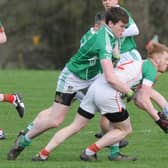 Shane Sheridan on the ball for Mostrim in this tussle with Clonguish opponent Peter Hanley. Action from the All County Football League Division 1 game at Devine Park. Photo: Declan Gilmore