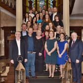 Tom O'Connor, pictured front left, with management and staff of O'Neill Foley, Kilkenny