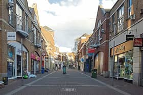 Late night shopping: Nigel’s pictures demonstrate the contrast between Cruise’s Street and the Crescent Shopping Centre, below, on Thursday around 7pm