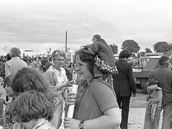 A girl with a monkey on her back at the Limerick Show in August 1978