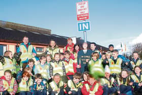 Junior infants from Lisnagry NS and teachers Patrick O’Neill, Sheena McDonald, Maura Barry with one of their new road safety signs   Picture: Michael Cowhey