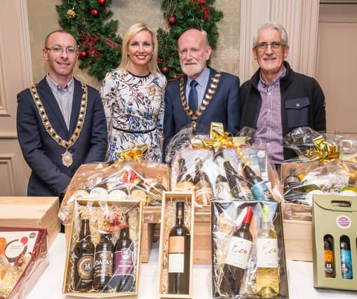 Mayor Michael Doyle, Dara O'Reilly-Daly, Brian O'Callaghan and John O'Regan during the Wine Fair in aid of the Lions Club PICTURE: PAT MOORE