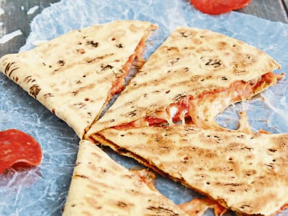 Quesadilla is a folded corn or flour tortilla, filled with cheese and other fillings