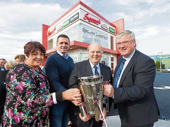 Una McDonagh, Alan Quinlan, former Minister for Finance Michael Noonan and Pat McDonagh with the Liam McCarthy Cup at the official opening of Supermacs Ballysimon Picture: Eamon Ward