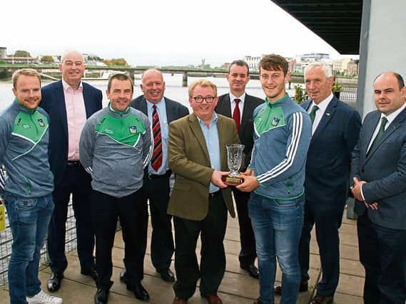 Dave O'Hora of media agency Southern (award sponsors) presenting the Limerick Person of the Month award to Tom Morrissey, captain of the Limerick U-21 hurling team