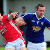 Ballymahon's Colm Flynn in a tussle with St Mary's Granard opponent Charlie Martin in the Senior Football Championship Group 3 second round clash last weekend. Photo: Declan Gilmore