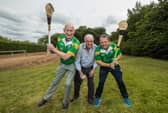 Cyril Farrell gets the game going with a throw in between opposing managers Brian Cody and Davy Fitzgerald