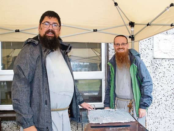 Firing up the barbecue: Fr Charles Reche, the longest serving Friar with Fr Bernardino, in Moyross Pictures: Michael Cowhey