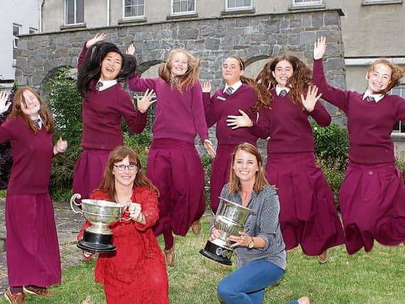 Laurel Hill Colaiste FCJ celebrate one of their earlier wins with principal Aedin Ni Bhriain and vice principal Norma Ni Luinneachain Picture: Michael Cowhey