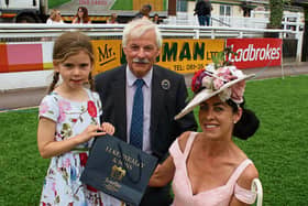 Limerick Show president, Leo Walsh with Grace Kenneally, who presented the most stylish lady winner, Grace Flynn with her prize Picture: Michael Cowhey