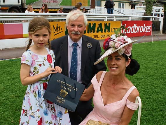 Limerick Show president, Leo Walsh with Grace Kenneally, who presented the most stylish lady winner, Grace Flynn with her prize Picture: Michael Cowhey